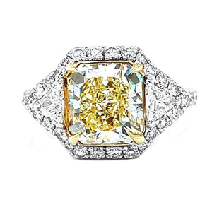 Natural Radiant Cut Fancy Yellow Diamond with Triangle Cut Diamond Halo Ring, in White Gold