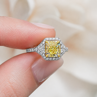 Natural Radiant Cut Fancy Yellow Diamond with Triangle Cut Diamond Halo Ring 18KT White Gold