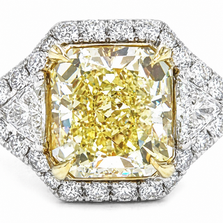 Natural Radiant Cut Fancy Yellow Diamond with Triangle Cut Diamond Halo Ring 18KT White Gold