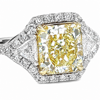 Natural Radiant Cut Fancy Yellow Diamond with Triangle Cut Diamond Halo Ring 18KT White Gold