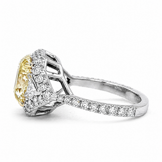 Natural Radiant Cut Fancy Yellow Diamond with Triangle Cut Diamond Halo Ring 18KT White Gold