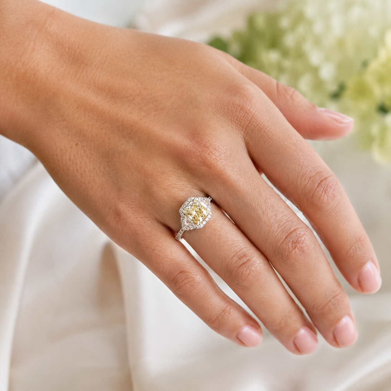 Natural Radiant Cut Fancy Yellow Diamond with Triangle Cut Diamond Halo Ring 18KT White Gold