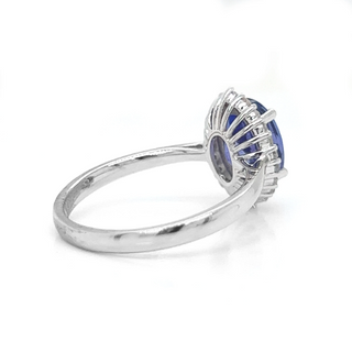 Natural Oval Tanzanite and Natural Mined Round Diamond Halo Floral White Gold Ring