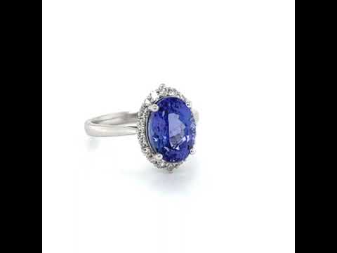 Natural Oval Tanzanite and Round Diamond Halo Floral White Gold Ring